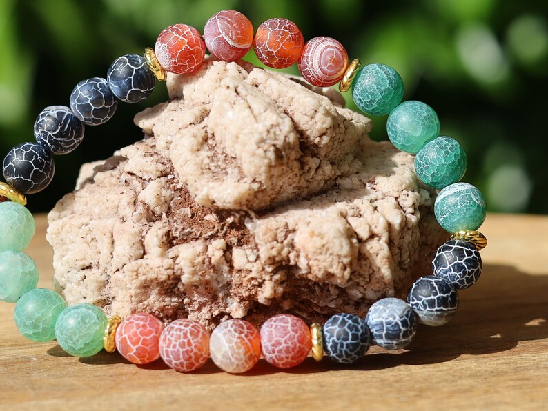 Top black,red and green Frosted Fire Crackle Agate bracelet with Tibetan Style Alloy Spacer Discs.The art of expressing your taste and style