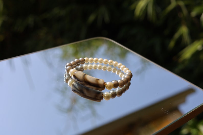 Bracelet with acrylic tube bead and Glass Pearl Graphite, Acrylic pearls and Tibetan alloy material in Antique Gold