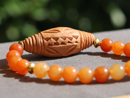 Orange Jade Chalcedony with Beautiful large handmade terracotta beads from Mali (Africa). And Tibetan Style Alloy Spacer Discs
