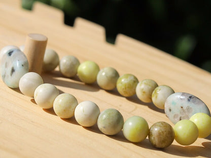 Yellow Turquoise bracelet with A beautiful set of 2 oval beads: real Kiwi Jasper. Yellow Turquoise enhances intuition and personal power.