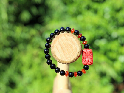 Onyx is a beautiful and unique gemstone. Combined with beautiful, large handcrafted Buddhist bead from real Cinnabar.
