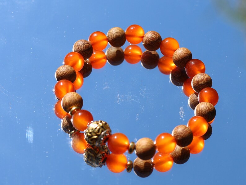 Madre de Cacao Wood beads with Carnelian  and Great Bright Mantra Om Bead. mantra's essence is powerful and pure