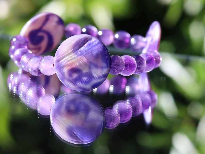 Coin shaped Mother of Pearl Shell beaded bracelet with Amethyst is a natural tranquilizer. powerful way to express your individuality