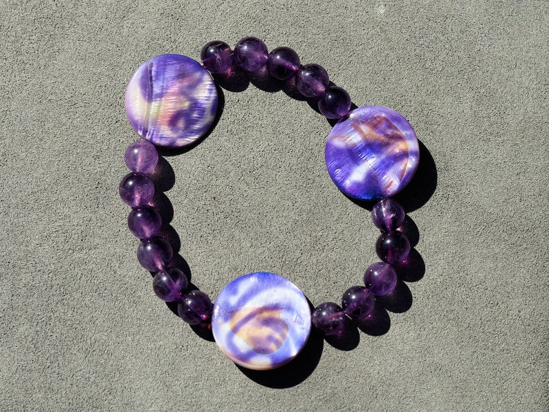 Coin shaped Mother of Pearl Shell beaded bracelet with Amethyst is a natural tranquilizer. powerful way to express your individuality