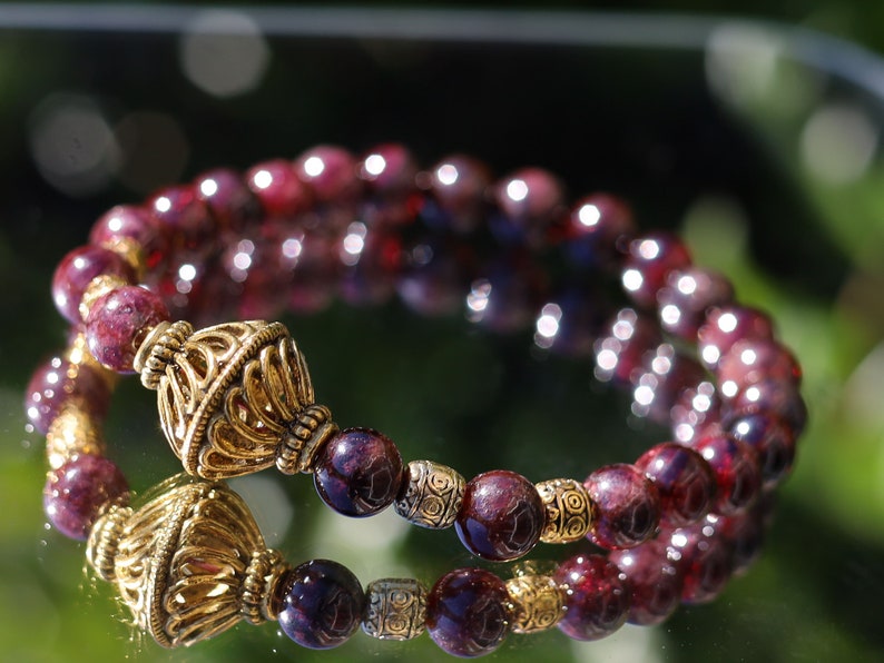 Amazing Dark Red Garnet beaded bracelet with Lovely, large Mala bead and Handmade Indonesia Beads. expressing your taste and style