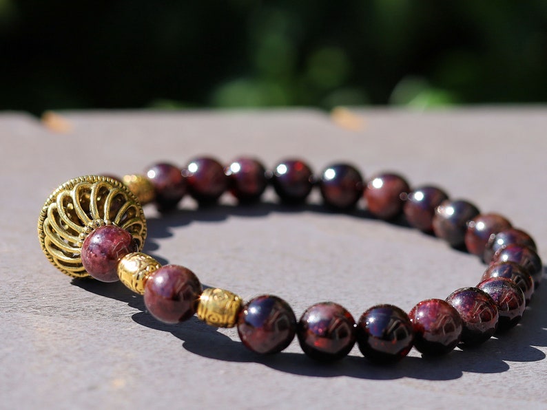 Amazing Dark Red Garnet beaded bracelet with Lovely, large Mala bead and Handmade Indonesia Beads. expressing your taste and style