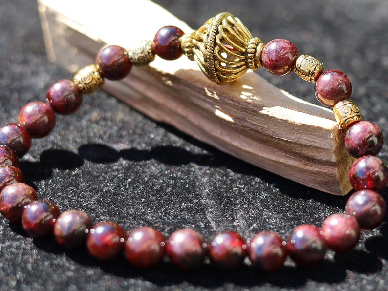 Amazing Dark Red Garnet beaded bracelet with Lovely, large Mala bead and Handmade Indonesia Beads. expressing your taste and style