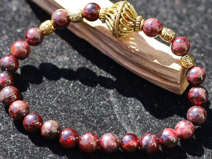 Amazing Dark Red Garnet beaded bracelet with Lovely, large Mala bead and Handmade Indonesia Beads. expressing your taste and style