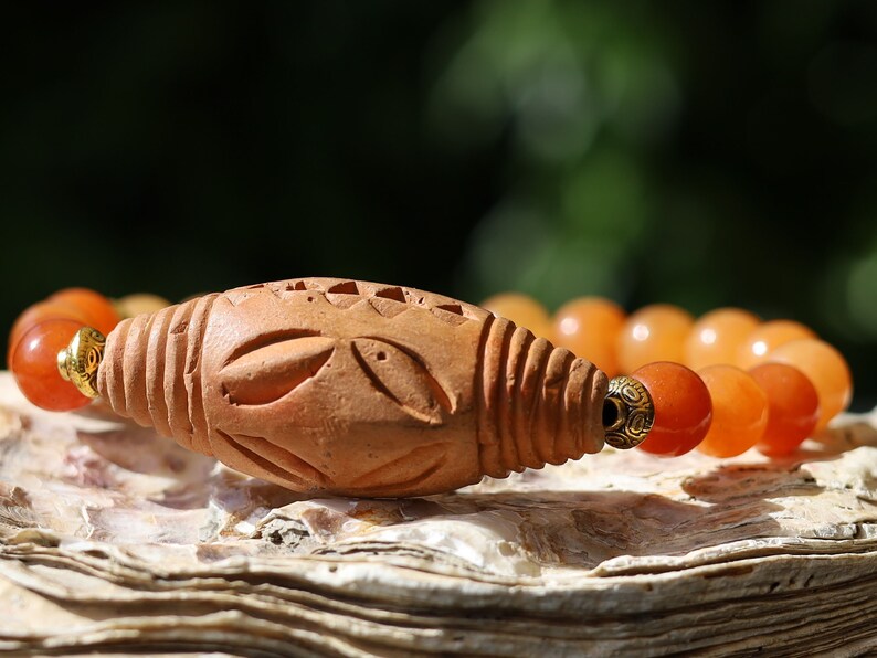 Orange Jade Chalcedony with Beautiful large handmade terracotta beads from Mali (Africa). And Tibetan Style Alloy Spacer Discs