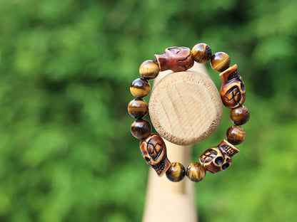 Skull jewelry, also known as skull-themed jewelry. Combined with polyresin Mens Skull Bead and Tiger eye 12 mm beads.
