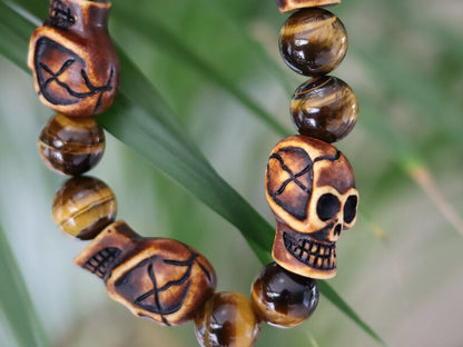 Skull jewelry, also known as skull-themed jewelry. Combined with polyresin Mens Skull Bead and Tiger eye 12 mm beads.