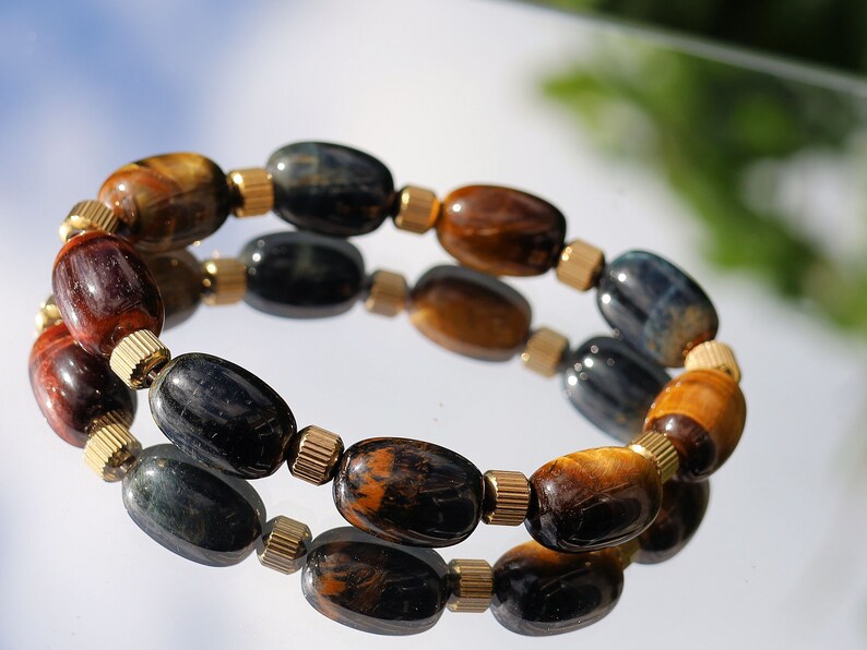 Appealing unique oval Tiger Eye beaded bracelets. With Stainless Steel Beads Gold Color 6mm Ribbed Cyclinder Tube Spacers.