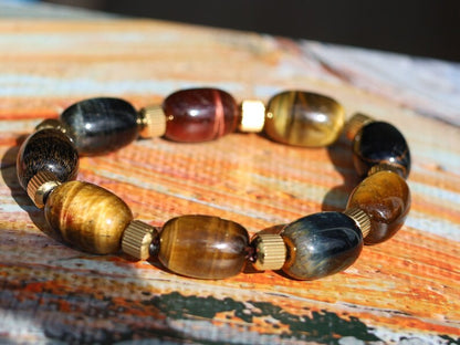 Appealing unique oval Tiger Eye beaded bracelets. With Stainless Steel Beads Gold Color 6mm Ribbed Cyclinder Tube Spacers.