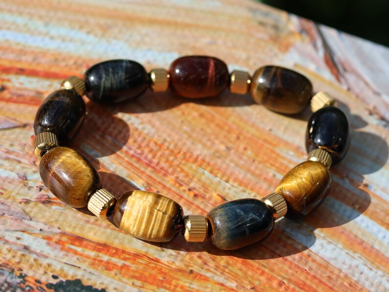 Appealing unique oval Tiger Eye beaded bracelets. With Stainless Steel Beads Gold Color 6mm Ribbed Cyclinder Tube Spacers.