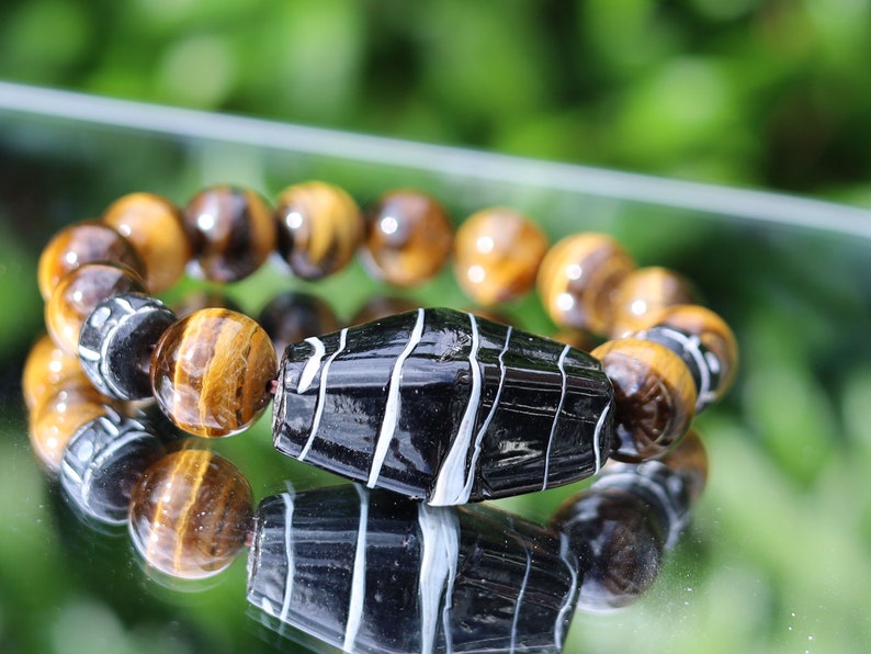 Handmade black/ white striped glass beads combined Tiger eye 12 beads. Tiger Eye stabilizes mood swings, imbues us with willpower