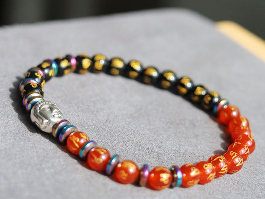 Elevate your spiritual journey and personal style with our stunning Natural Obsidian Beaded Bracelet, graced with a beautifully carved round "Om Mani Padme Hum" design.