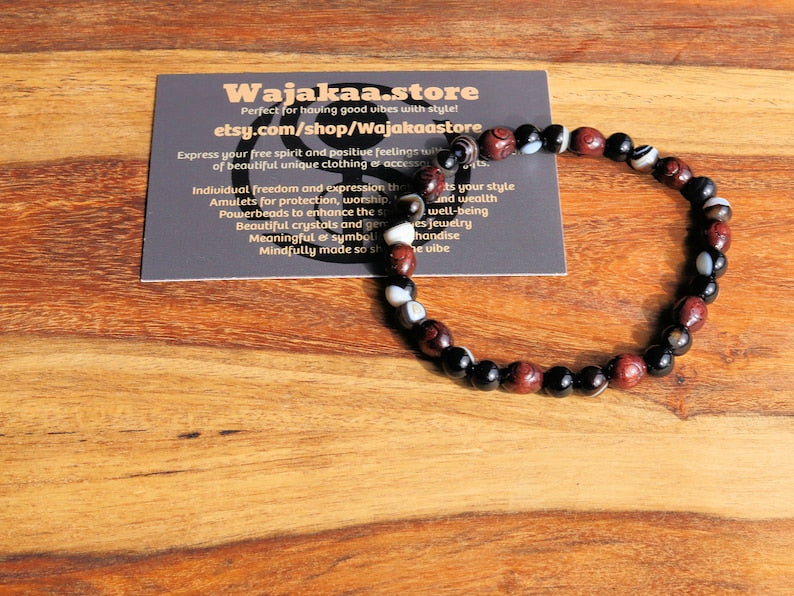 Unique Natural bracelets. engraved stylized spiral decoration,  Jichimu Wood bracelet, Crazy Horse Stone with black Agate
