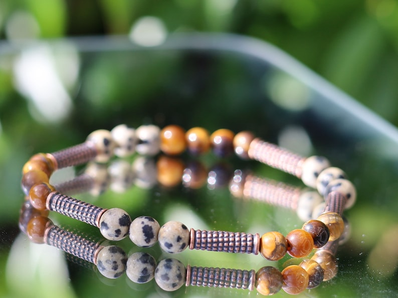 Unique Natural bracelets. engraved stylized spiral decoration,  Jichimu Wood bracelet, Crazy Horse Stone with black Agate