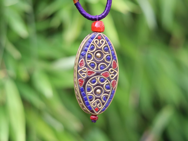 Oval with Teardrop, pendant with Hand Knotted Adjustable Cord String Necklace. Handmade Indonesian beads are exquisite and diverse