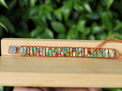 Design: the chakra bracelet using alloy knob for size adjustment. Handmade brown leather interwoven with brown thread.