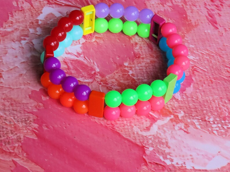 Introducing our stunning multi color Double-Row UV-Reactive Bracelet , the ultimate accessory to light up your night,UV Reactive Fluorescent