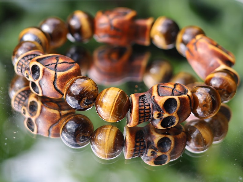 Skull jewelry, also known as skull-themed jewelry. Combined with polyresin Mens Skull Bead and Tiger eye 12 mm beads.