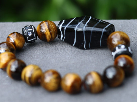 Handmade black/ white striped glass beads combined Tiger eye 12 beads. Tiger Eye stabilizes mood swings, imbues us with willpower
