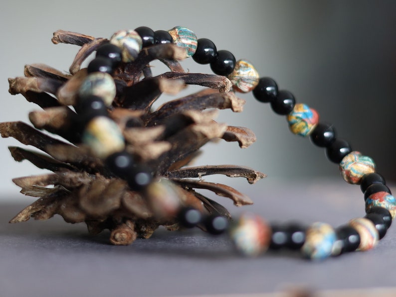 Thai prayer beads made from clay are known as Sai Sin or Buddhist prayer beads. With Black agate is believed to be a powerful stone