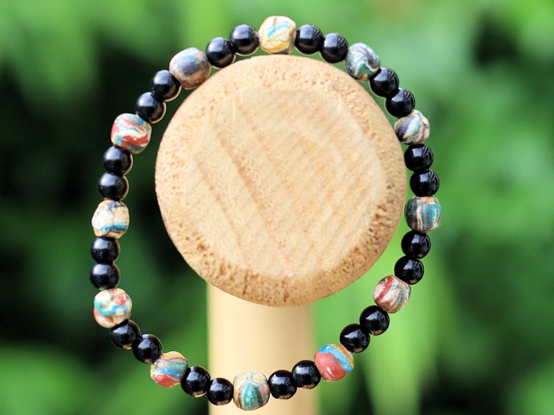 Thai prayer beads made from clay are known as Sai Sin or Buddhist prayer beads. With Black agate is believed to be a powerful stone