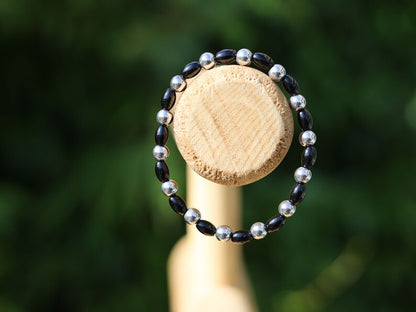 Natural Black Agate Barrel Beads. With Elegant 6mm Hematite Beaded Bracelet, a timeless accessory that combines style and substance.