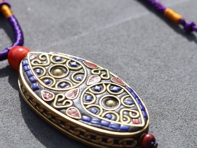 Oval with Teardrop, pendant with Hand Knotted Adjustable Cord String Necklace. Handmade Indonesian beads are exquisite and diverse