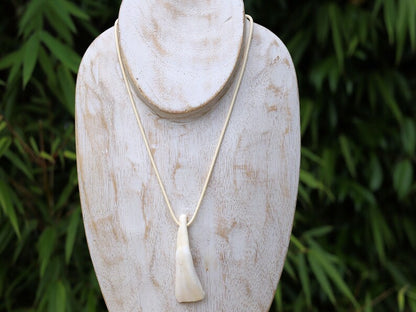 Large Native American Pendant: Buffalo Tooth. The buffalo tooth is a symbol of strength, resilience, and connection to nature.