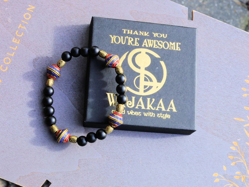 Nepal models Shaligram Super rare Natural black round bracelets. With Nepalese brass decorative round beads. Handmade in Nepal.