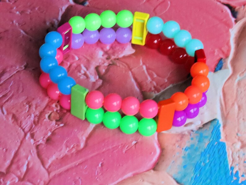 Introducing our stunning multi color Double-Row UV-Reactive Bracelet , the ultimate accessory to light up your night,UV Reactive Fluorescent