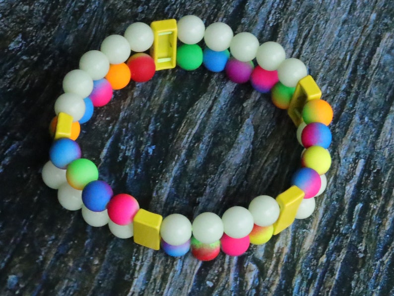 Introducing our stunning multi color Double-Row UV-Reactive Bracelet , the ultimate accessory to light up your night,UV Reactive Fluorescent