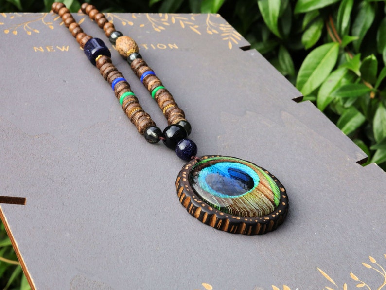 wooden beads peacock feather necklace. Weight: about 20 grams. Pendant size: round: 4.9*4.9*1.3cm; ellipse: 5.2*4.1*1.1cm