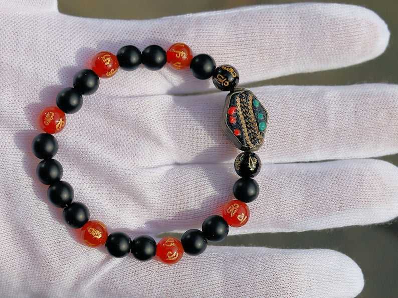 8MM Feng Shui Red Color obsidian With Buddhist Words Om Mani Padme Hum Mantra. The jewel is in the lotus.