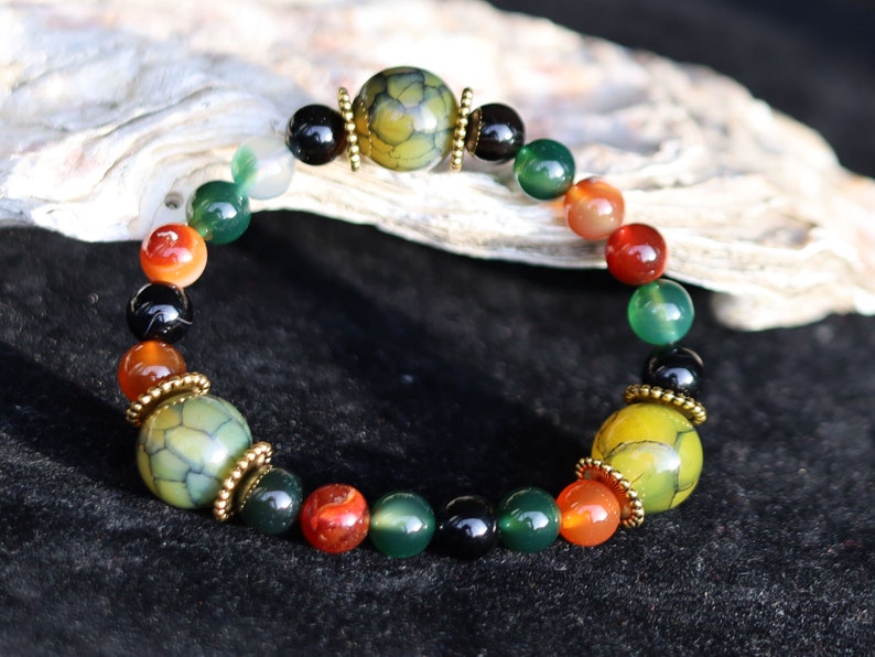 A mixed color agate beads bracelet with green/ black Dragon veins natural jade and Gold Plated Spacer Beads. the scales or veins of a dragon