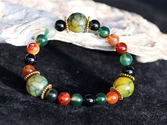 A mixed color agate beads bracelet with green/ black Dragon veins natural jade and Gold Plated Spacer Beads. the scales or veins of a dragon