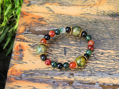 A mixed color agate beads bracelet with green/ black Dragon veins natural jade and Gold Plated Spacer Beads. the scales or veins of a dragon