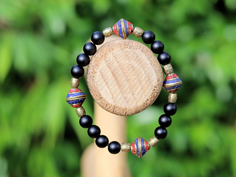Nepal models Shaligram Super rare Natural black round bracelets. With Nepalese brass decorative round beads. Handmade in Nepal.