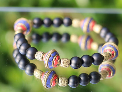 Nepal models Shaligram Super rare Natural black round bracelets. With Nepalese brass decorative round beads. Handmade in Nepal.