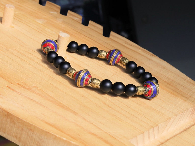 Nepal models Shaligram Super rare Natural black round bracelets. With Nepalese brass decorative round beads. Handmade in Nepal.