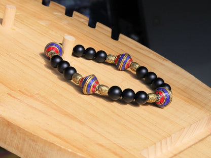 Nepal models Shaligram Super rare Natural black round bracelets. With Nepalese brass decorative round beads. Handmade in Nepal.