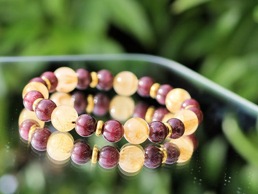 Red Garnet represents love with 10 mm Rutilated Quartz and Brass Spacer Beads. is known for its striking and beautiful appearance