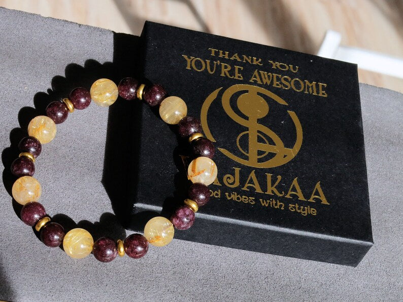 Red Garnet represents love with 10 mm Rutilated Quartz and Brass Spacer Beads. is known for its striking and beautiful appearance