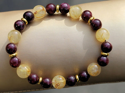 Red Garnet represents love with 10 mm Rutilated Quartz and Brass Spacer Beads. is known for its striking and beautiful appearance