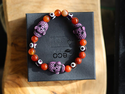 Crazy Lace Agate, EVIL EYE with Detailed, large resin bead: Skull. They can symbolize the acceptance of death as a natural part of life.