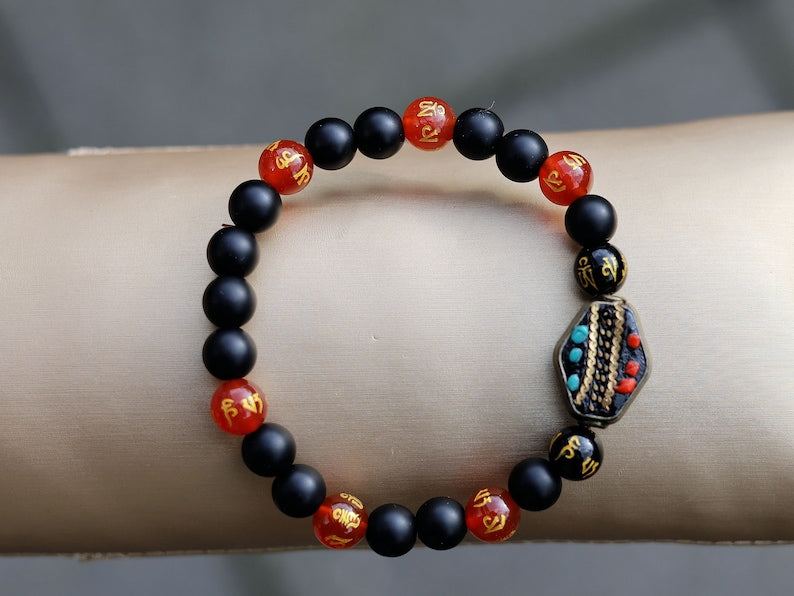 8MM Feng Shui Red Color obsidian With Buddhist Words Om Mani Padme Hum Mantra. The jewel is in the lotus.