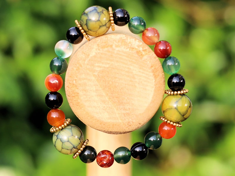 A mixed color agate beads bracelet with green/ black Dragon veins natural jade and Gold Plated Spacer Beads. the scales or veins of a dragon